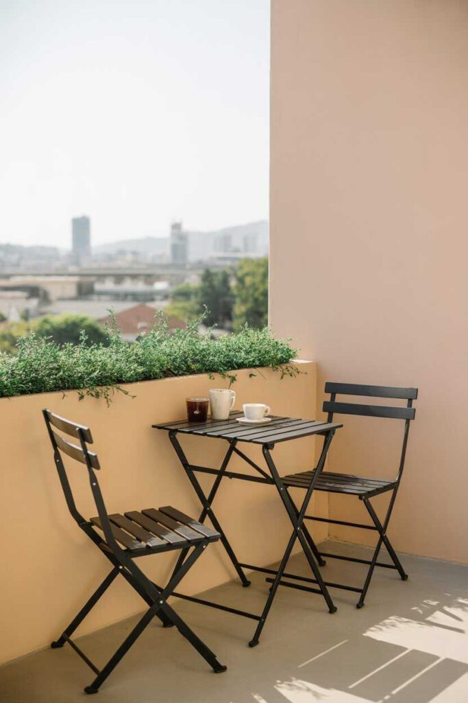 27+ Small Sunroom Ideas for a Cozy, Modern Space You’ll Love (Gorgeous Inspiration for Every Home) 4 Incorporate a Narrow Bistro Table for Morning Coffee Moments